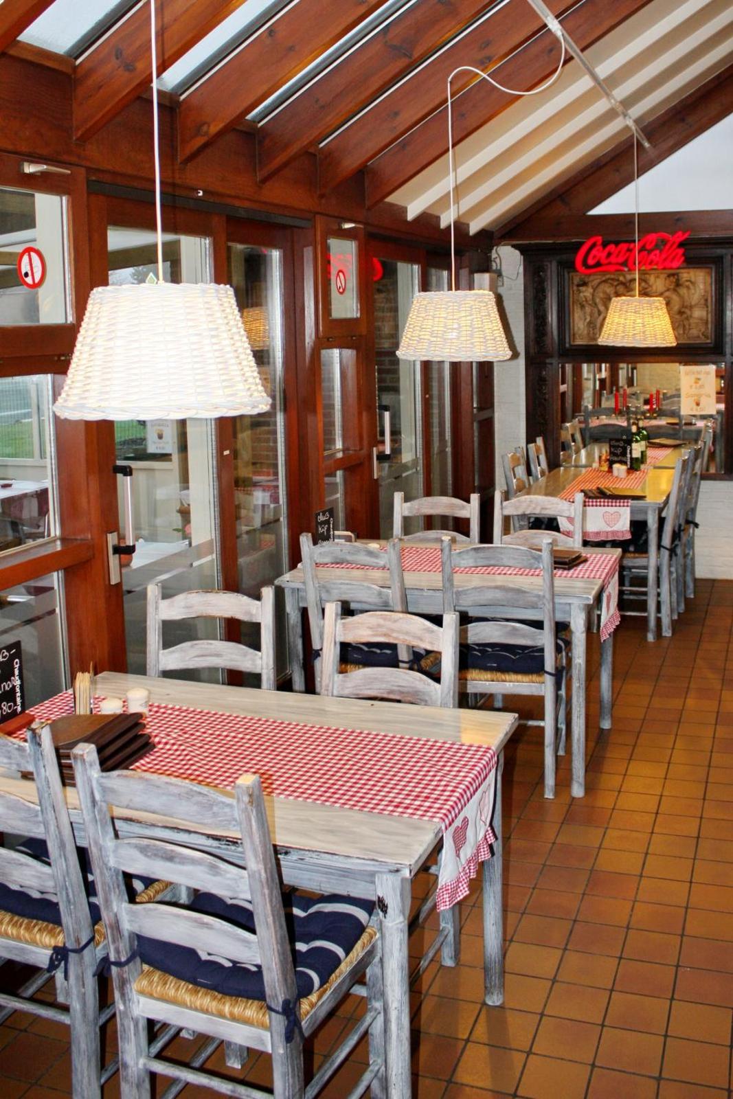 Warm restaurant interior at Hotel Plaza Lommel